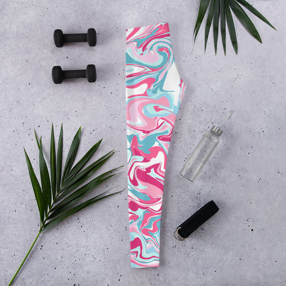 Photo of folded blue, white, and pink swirl tie dye leggings.