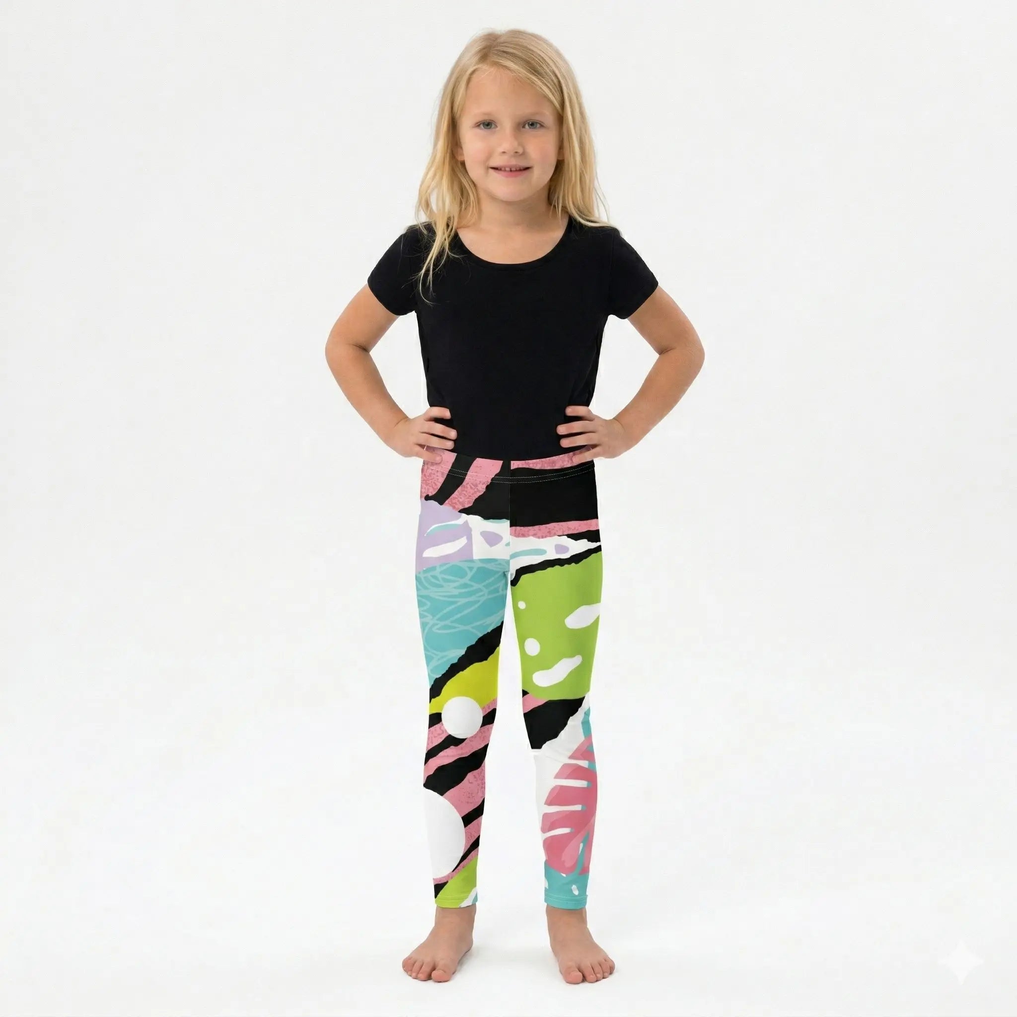 Child wearing a black t-shirt and colorful leggings on a white background